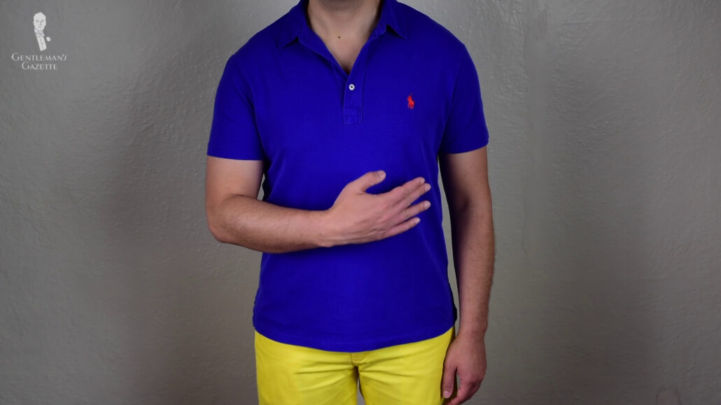 Raphael wearing a blue polo shirt and a pair of yellow shirts