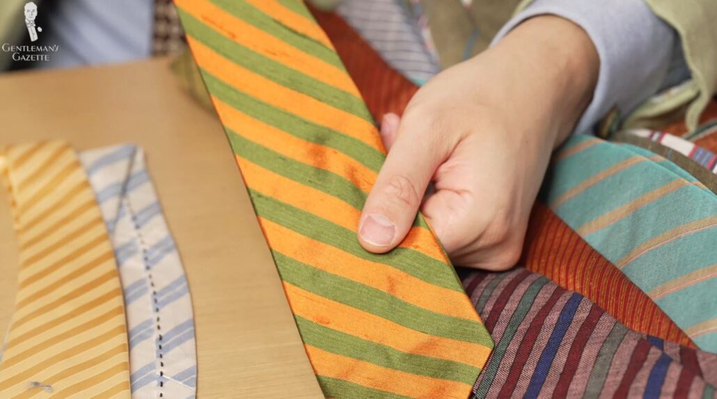 Here, we see a bold tie in a green and orange color combination