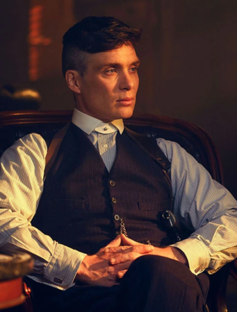 A photograph of Peaky Blinders character Tommy Shelby sitting 