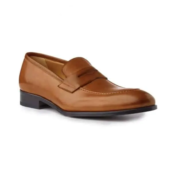 A pair of light brown penny loafers by Ace Marks