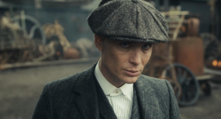 Tommy Shelby from The Peaky Blinders in a peaked cap in a screen shot from the TV series.