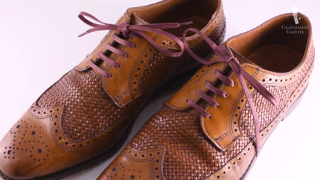 A pair of leather derbies with woven leather panels