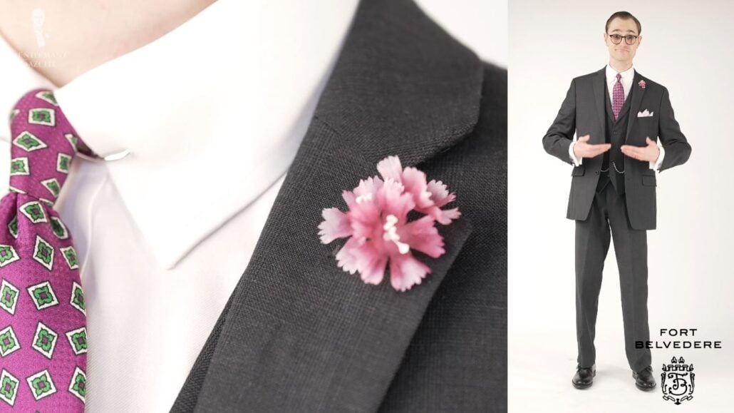 Preston in a charcoal gray three-piece suit featuring Fort Belvedere accessories