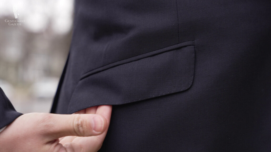 The suit's flat pockets.