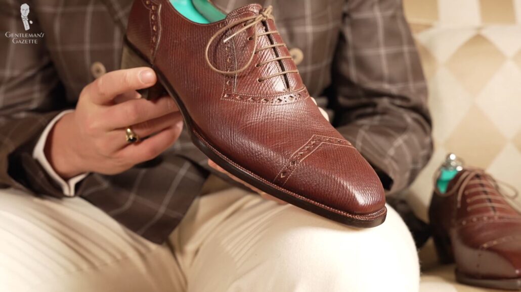 Here, we see the final bespoke shoe which is slightly different from the shoe tree