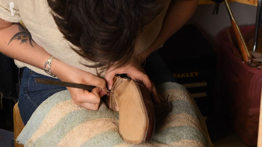 Amara carves the heel details