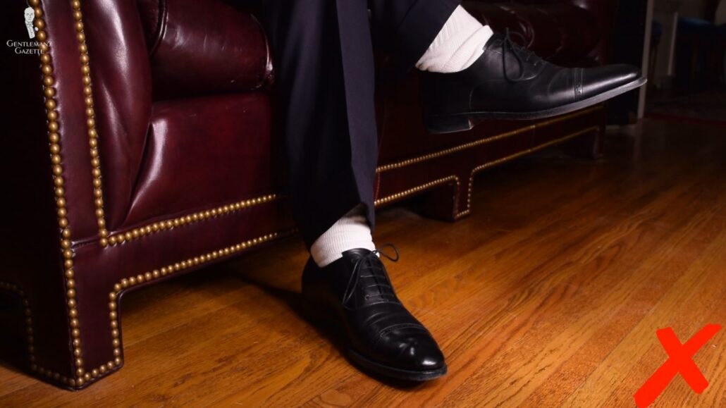 Wearing athletic socks with dress shoes is inappropriate for classic menswear