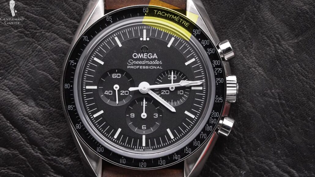 The tachymeter scale on an Omega Speedmaster watch is placed on the outer bezel