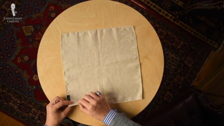 A pocket square spread flat on a table