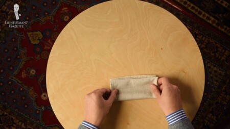 A pocket square is folded in half horizontally