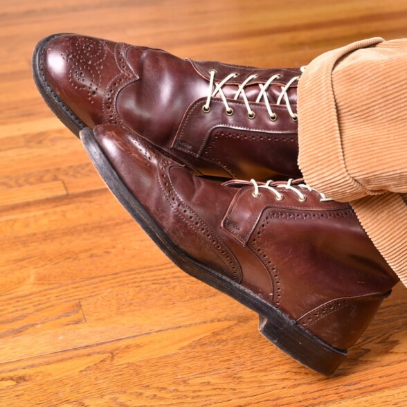 Cordovan boots with pink laces and tan corduroy trousers
