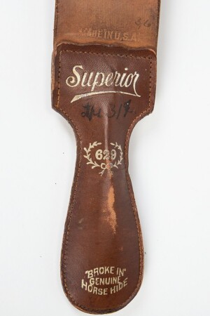 The handle of a vintage horsehide strop