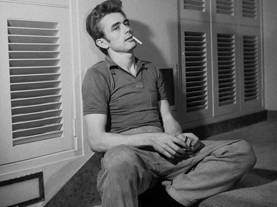 James Dean in a polo shirt and jeans.