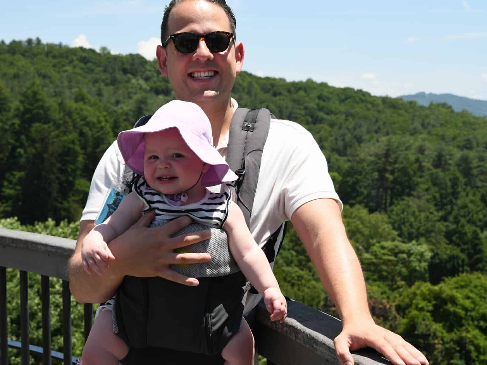There is no stylish way to carry a baby carrier - just suck it up and deal with it
