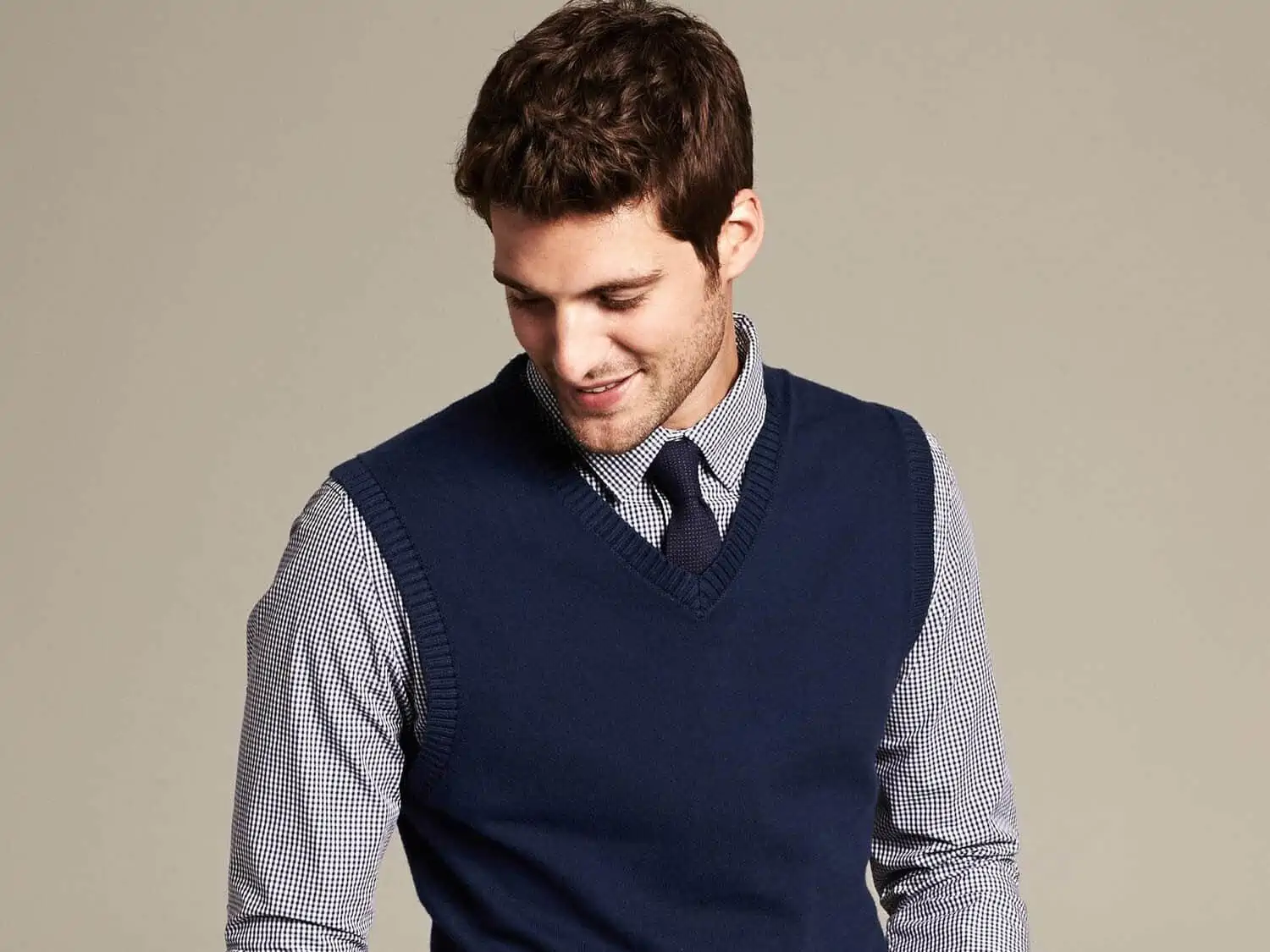 This sweater vest is perfect for layering or wearing under a blazer