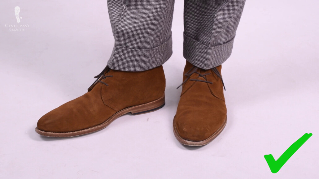 Your trousers should at least reach the top of your shoes.