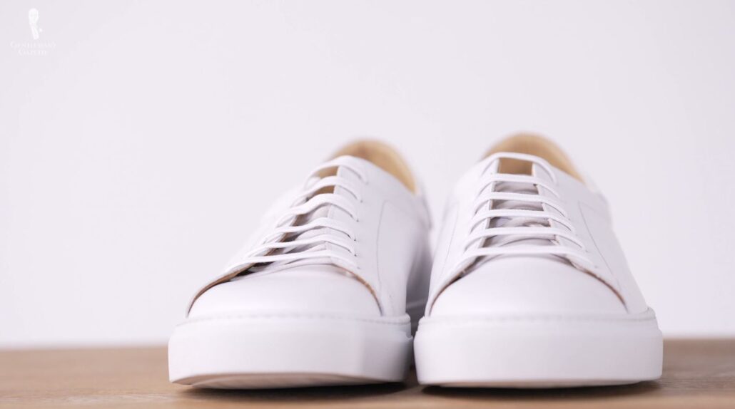 Dress sneakers typically have flat laces