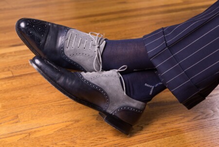 A pair of two tone Oxfords with a medallion detail on the toe