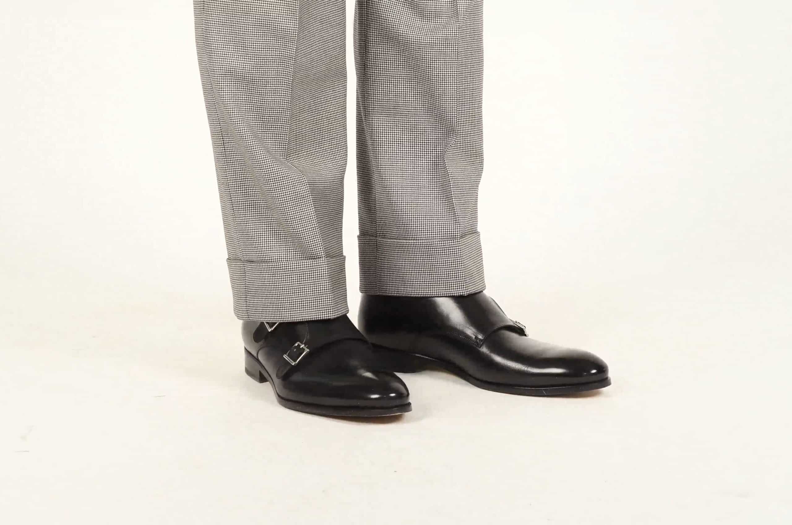 Black double monkstrap shoes shown here with black and white houndstooth trousers