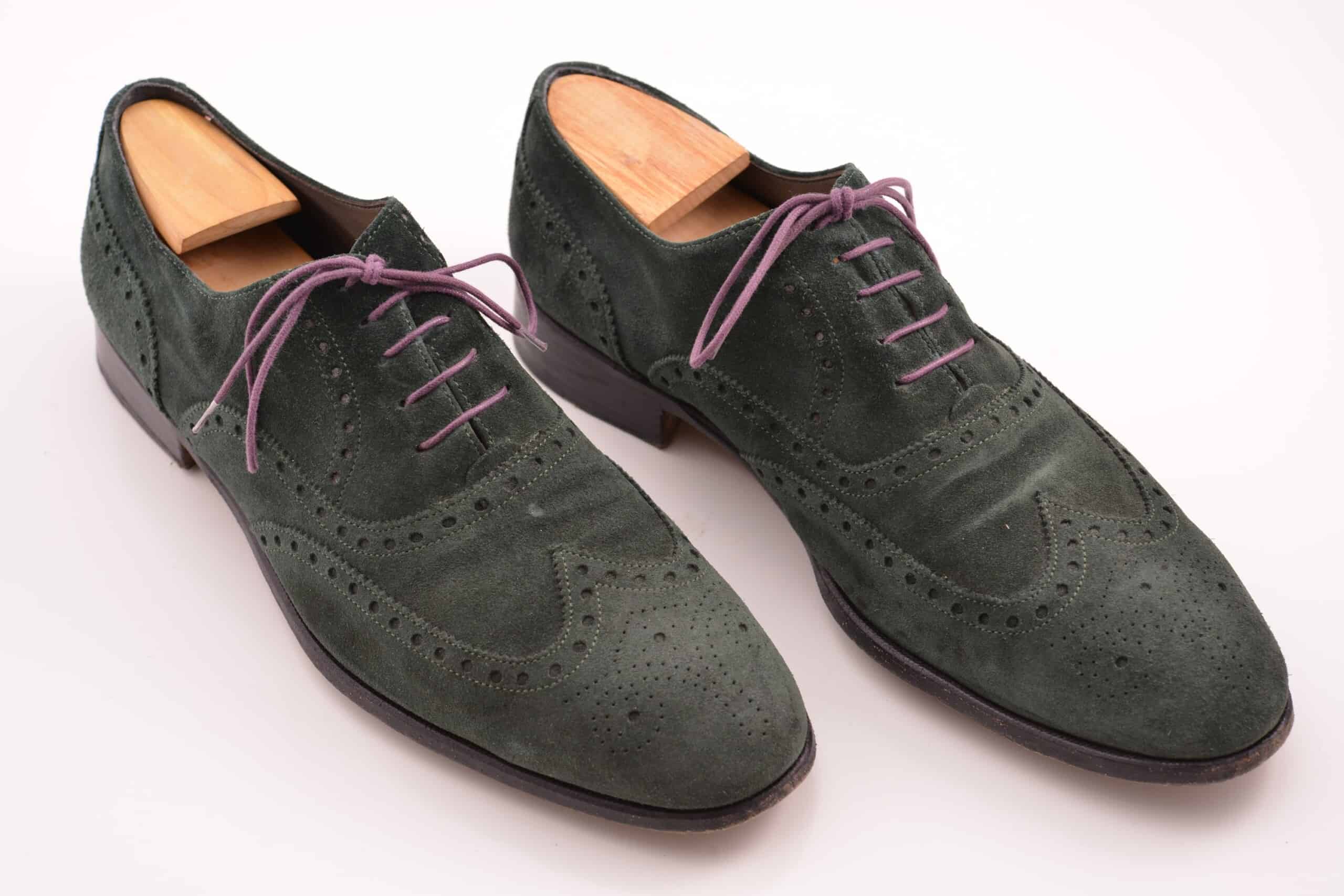 Green suede wingtip Oxfords with magenta laces
