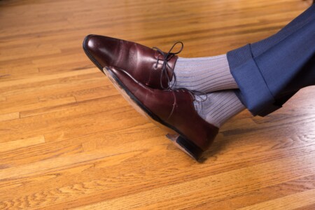 Oxblood Derby shoes with blue pants and grey socks