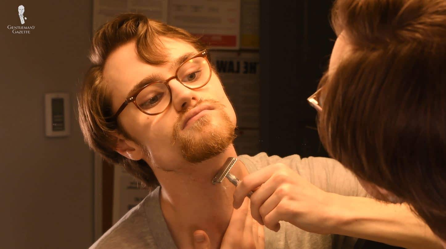Preston grooms his beard regularly; here, we see him carefully shaving it off the neck area
