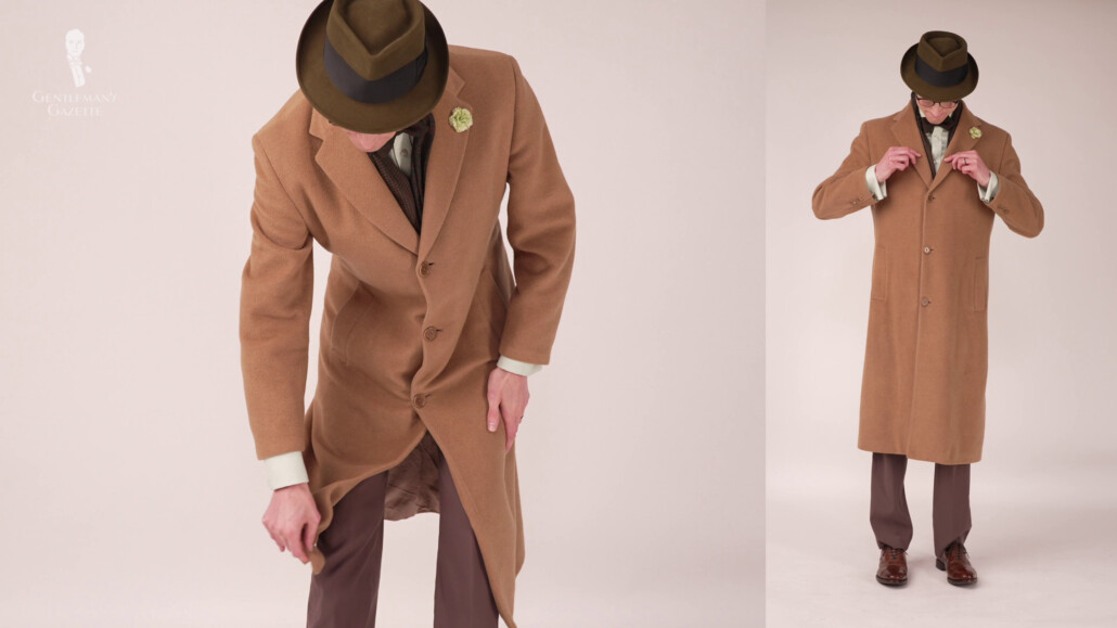 Preston in his favorite long overcoat to complement the rest of his outfit in tones of brown and green.