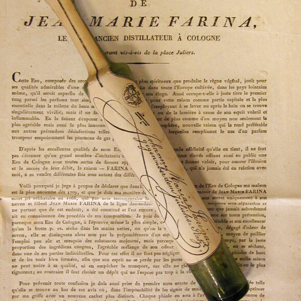 An eau de cologne by Farina, atop a scroll describing it.