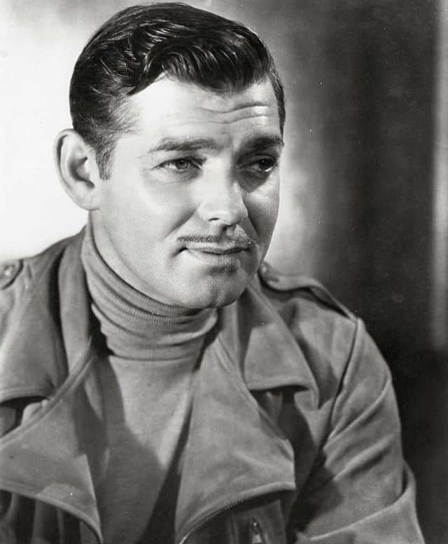 Clark Gable cuts a dash by wearing a suede jacket and thin turtleneck