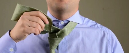 Feed the wide end through the front of the tie knot