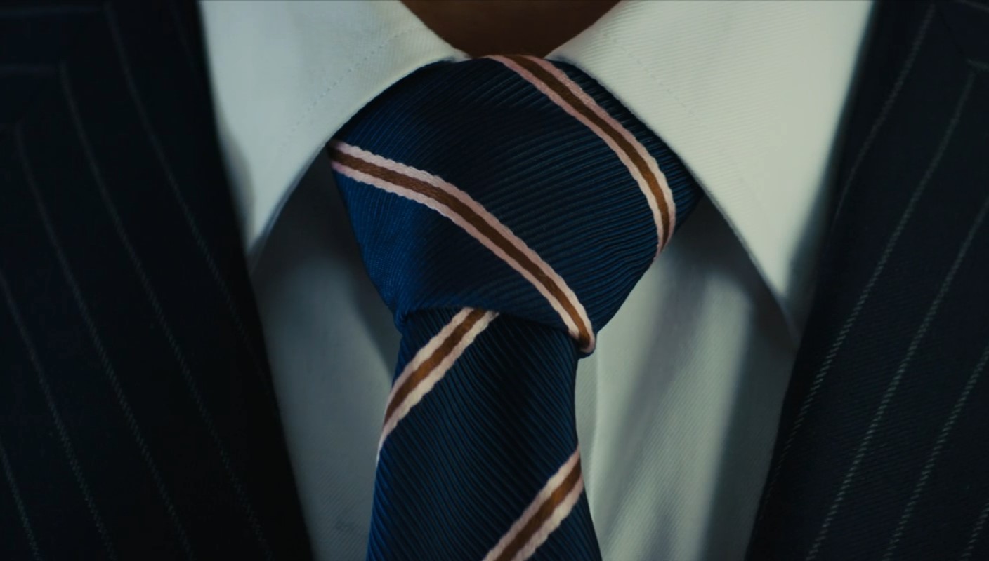 Kingsman agents wear the Half Windsor Knot with their rep stripe ties