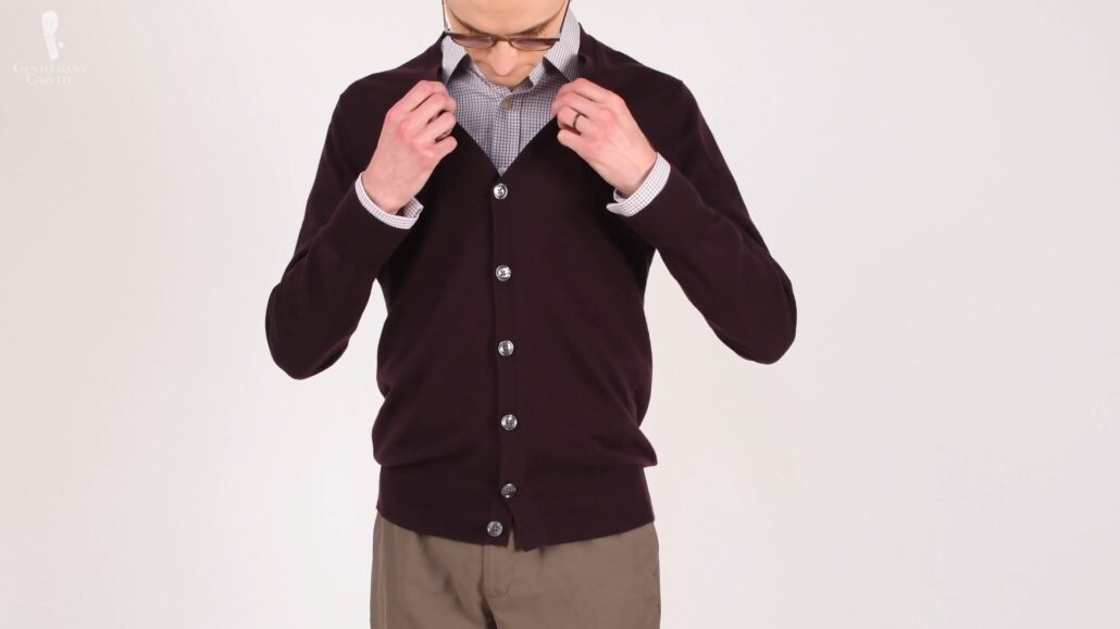Preston wearing his wine-colored merino wool cardigan and dress shirt from Charles Tyrwhitt.