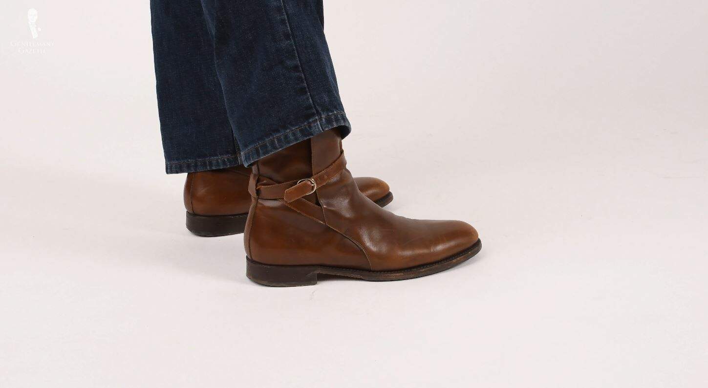 Jodhpur boots feature a buckle and a strap instead of an elastic gusset