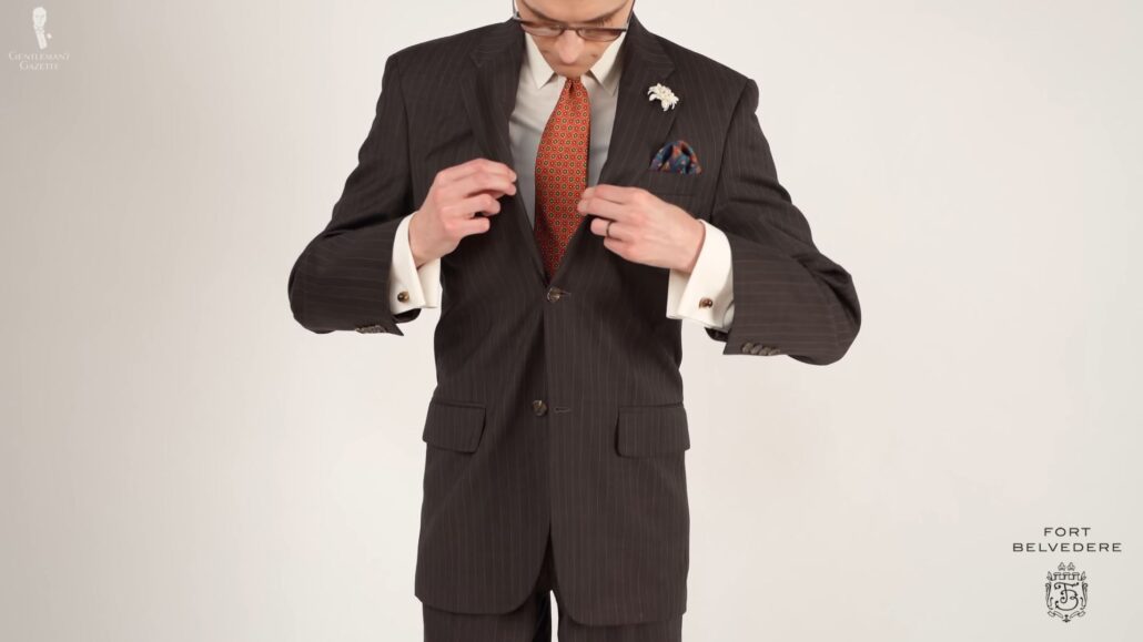 Preston in a formal office outfit with his vintage brown patterned suit as the key piece