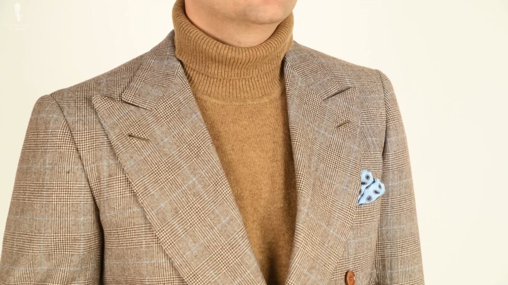 Pairing a turtleneck in a similar brown tone would elevate a fall-winter look (Pictured: Silk Pocket Square in Light Blue with Small and Large Paisley from Fort Belvedere)