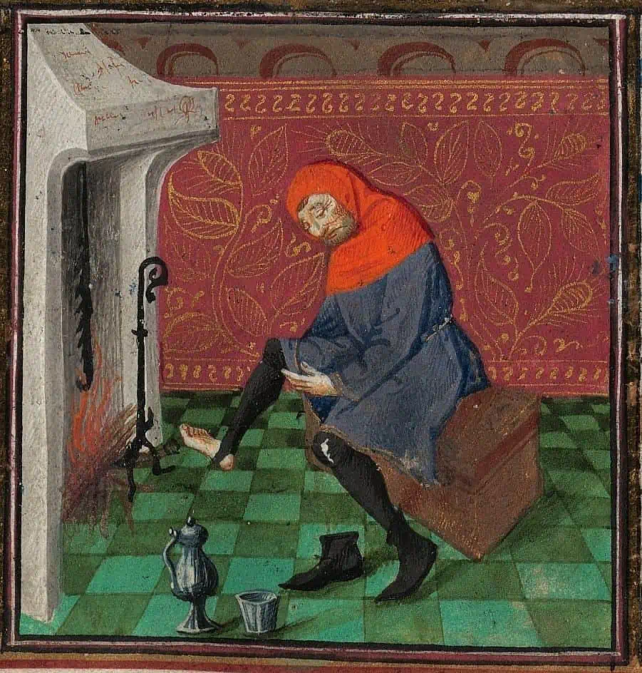 A medieval man puts on a pair of socks in a manuscript illustration. 