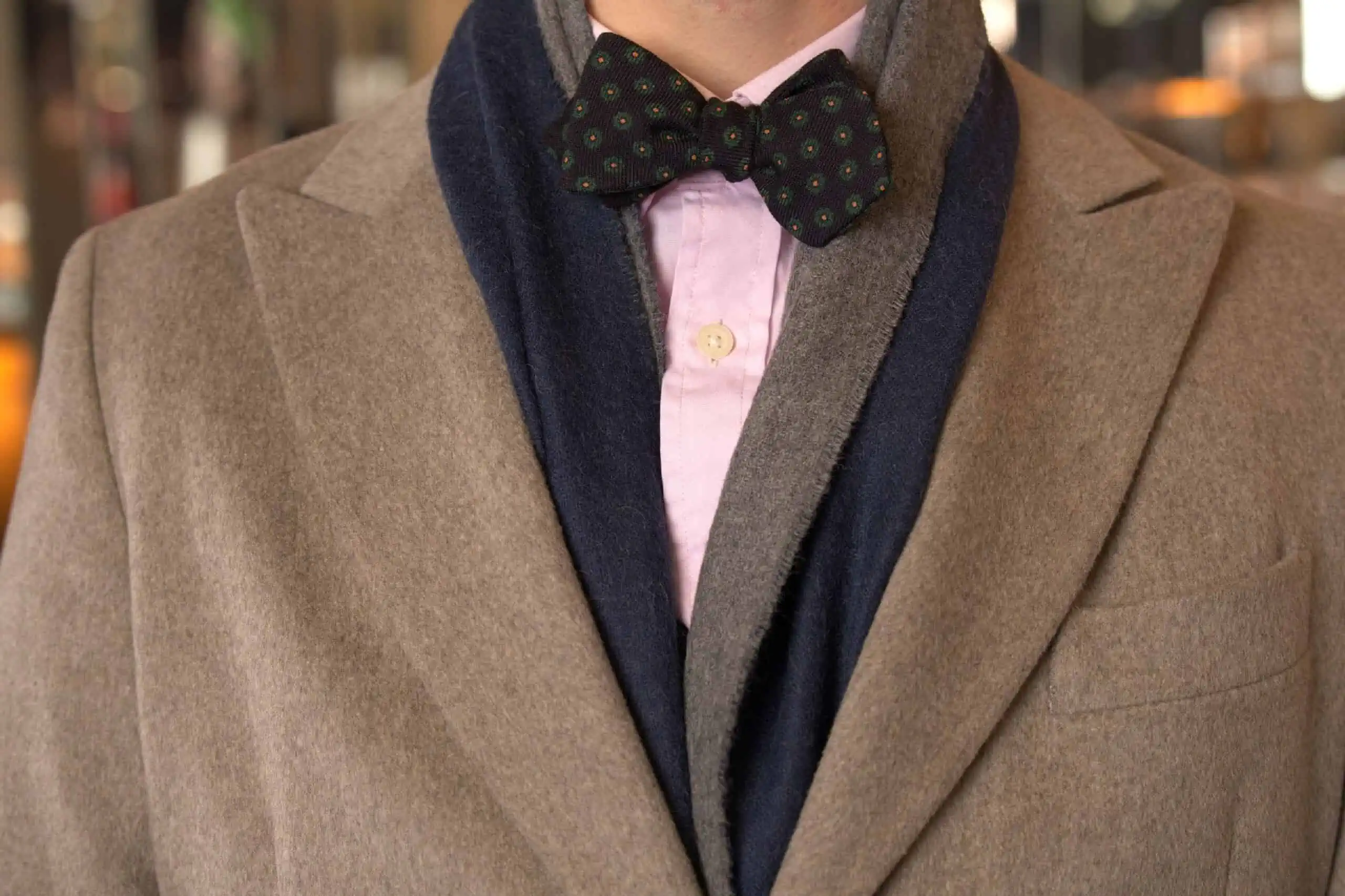 A photo of a Fort Belvedere Alpaca Scarf Double Sided in Dark Blue and Grey with bow tie