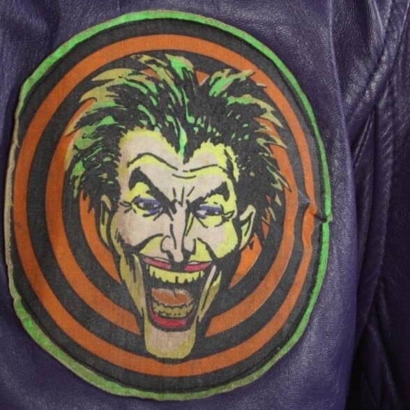 The Joker Ensured His Image Was Clearly Visable On The Jackets Worn By His Gang The Joker ensured his image was clearly visible on the jackets worn by his gang