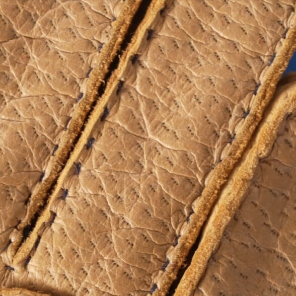 The three-pronged pore structure of genuine peccary leather.