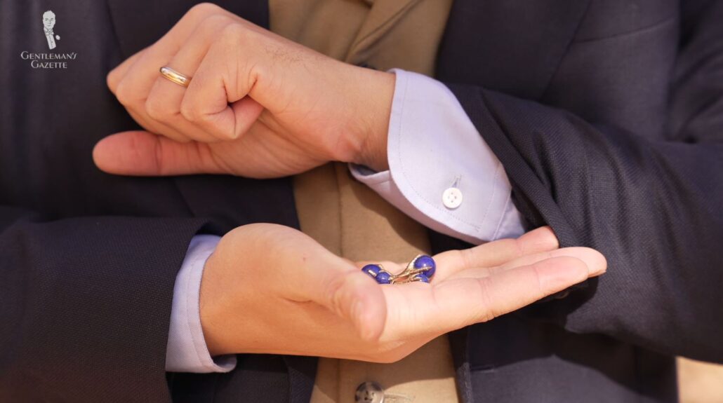 A pair of cufflinks can be a stylish little detail to a rather plain shirt (Pictured: Eagle Claw Cufflinks with Lapis Lazuli Balls from Fort Belvedere)