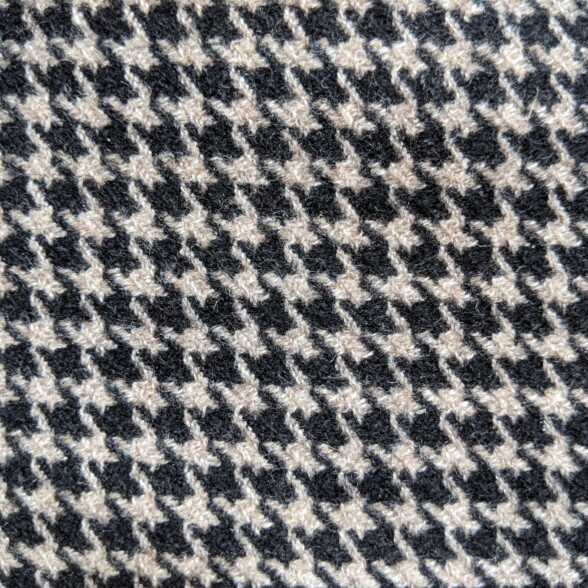 A close up image of a classic houndstooth pattern