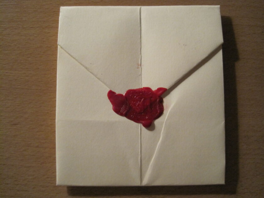 A photograph of a letter sealed with sealing wax