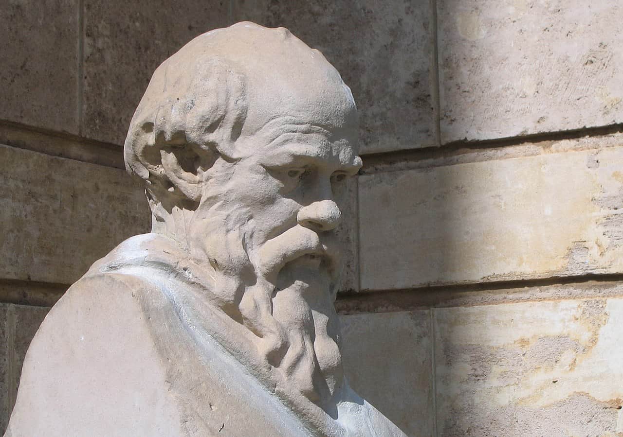 A stone carving of Socrates with a beard.
