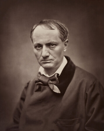A black and white photograph of Charles Baudelaire