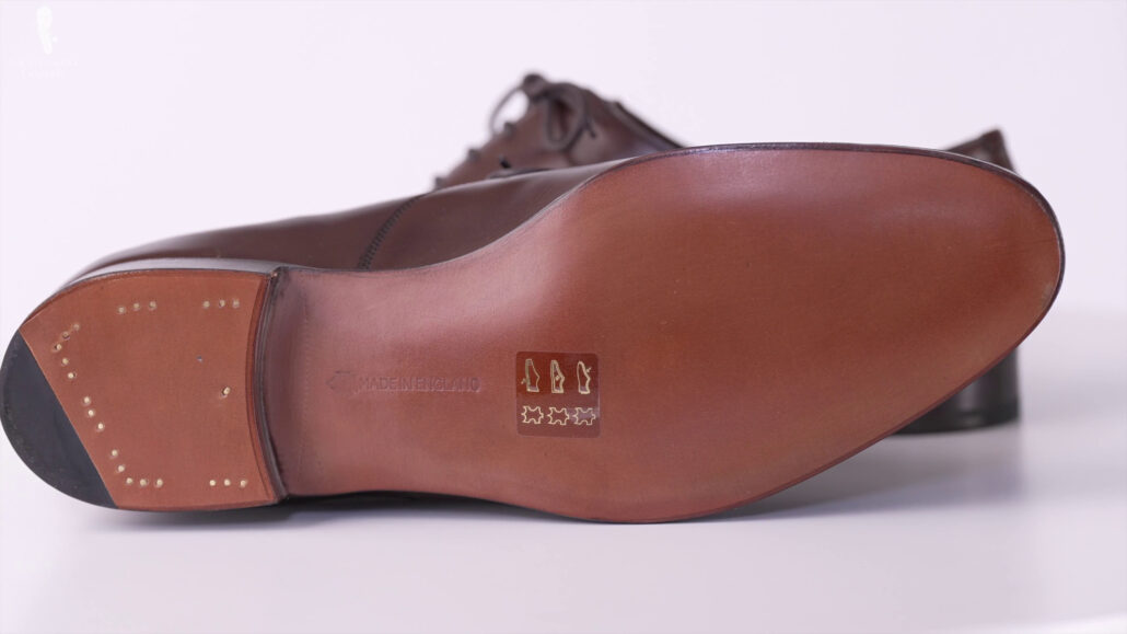 Invisible stitching to bespoke leather shoes.