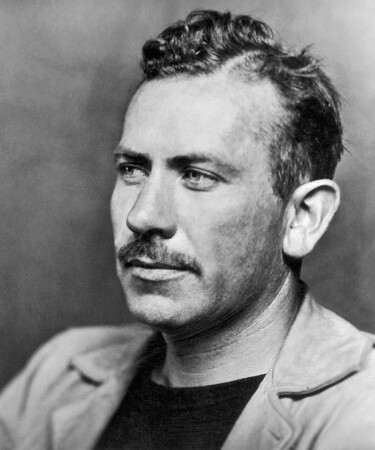 A black and white photograph of John Steinbeck