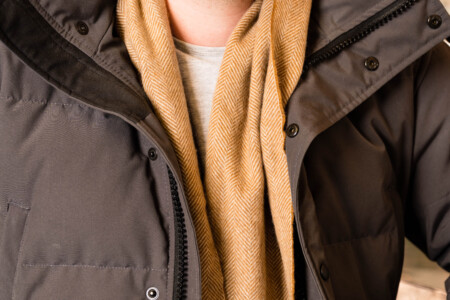 A closeup photo of a scarf worn with a puffer jacket