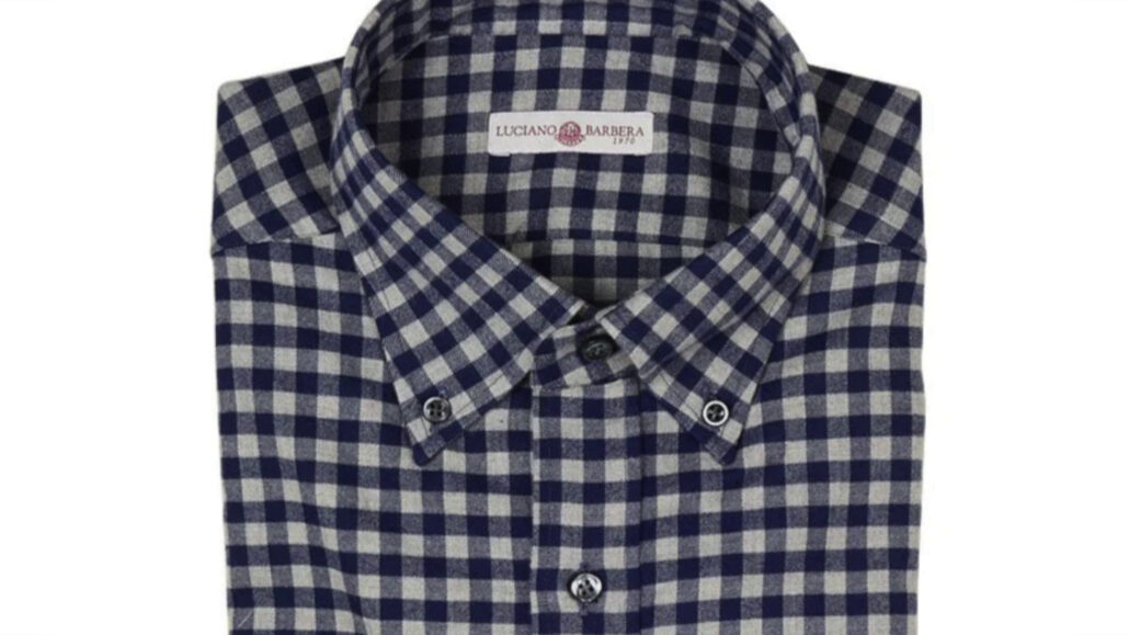 Interesting pattern for this blue checkered buttoned-down shirt.