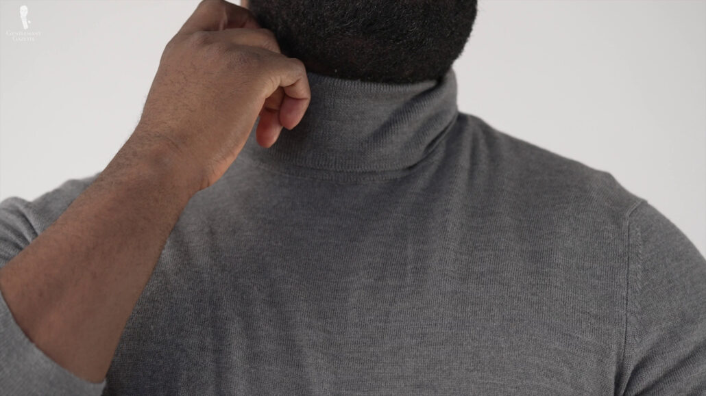 Go with the gray turtle neck shirt to compliment the trousers.
