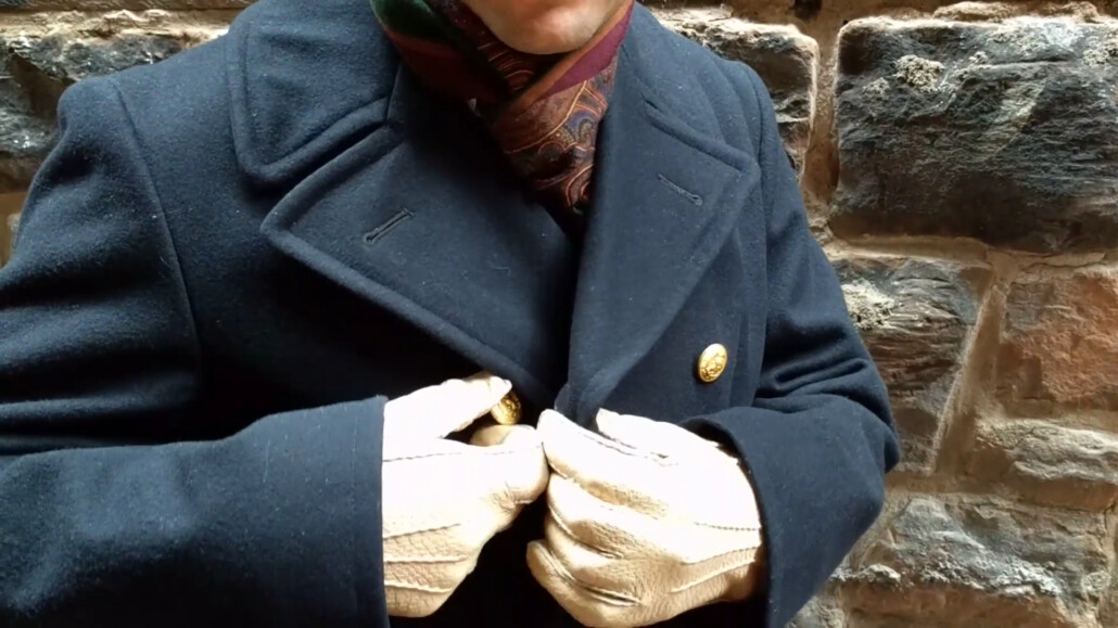 Raphael shows the collar and buttons of his peacoat